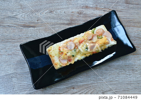 piece of pizza topping sausage and cheese on plate 71084449