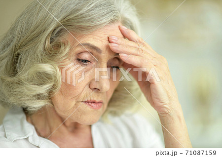 Close-up portrait of beautiful sad senior woman Close-up portrait of beautiful sad senior woman 71087159
