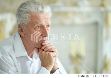 Close-up portrait of sad thinking senior man Close-up portrait of sad thinking senior man 71087186