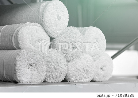 Rolls of factory textiles close-up. Raw material or material for making rags. Rolls of factory textiles close-up. Raw material or material for making rags. 71089239