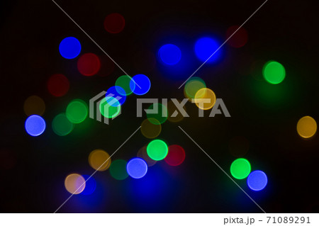 Abstract background, multicolored bokeh on a black background. 71089291