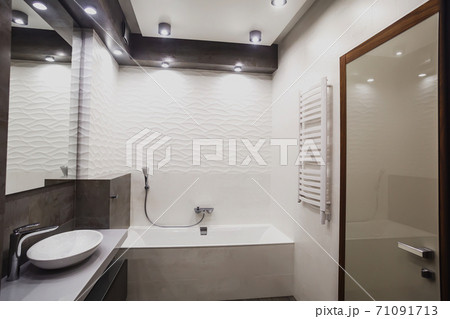 Modern bathroom in white and gray tones with mosaic on wide angle view Modern bathroom in white and gray tones with mosaic on wide angle view 71091713