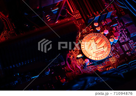 Litecoin Cryptocurrency coin on a PC computer motherboard, crypto currency mining concept Litecoin Cryptocurrency coin on a PC computer motherboard, crypto currency mining concept 71094876