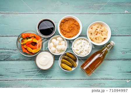 Variety of fermented foods on light mint background Variety of fermented foods on light mint background 71094997