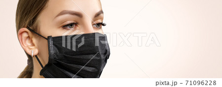 Eyelash Extension Procedure. Beautiful Woman with Extreme Long False Eyelashes. Makeup, Cosmetics. Beauty, Skincare. Woman in medical mask. Eyelash Extension Procedure. Beautiful Woman with Extreme Long False Eyelashes. Makeup, Cosmetics. Beauty, Skincare. Woman in medical mask. 71096228