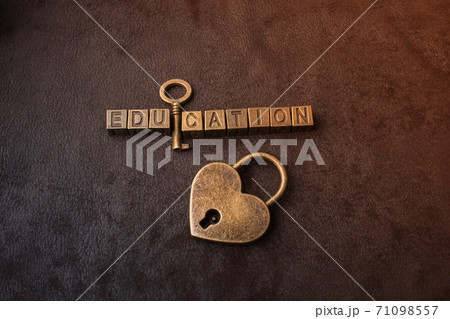Love shaped padlock, key and education wording 71098557