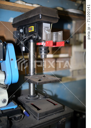 Drilling machine with a drill inserted. Metal drilling Drilling machine with a drill inserted. Metal drilling 71100141