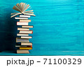 Books on wooden desk table and abstract background. Education background. Copy Space. Back to school. 71100329