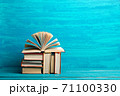 Books on wooden desk table and abstract background. Education background. Copy Space. Back to school. 71100330