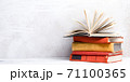 Books on wooden desk table and abstract background. Education background. Copy Space. Back to school. 71100365