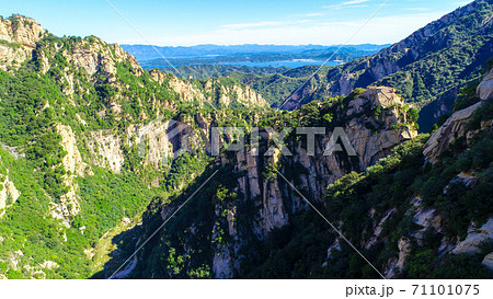 Aerial view of mountain with water reservoir on the background with beautiful blue sky 71101075