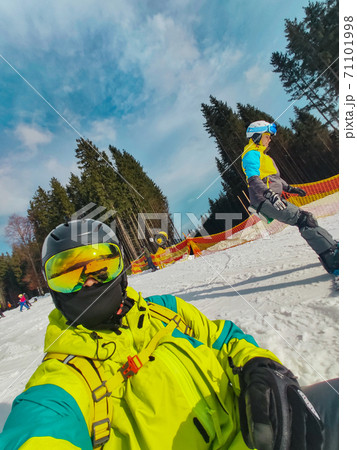 man taking selfie in ski mask and goggles at snowed hill man taking selfie in ski mask and goggles at snowed hill 71101998