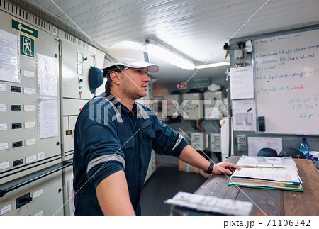 Marine engineer officer in engine control room ECR Marine engineer officer in engine control room ECR 71106342