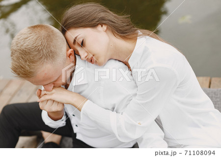 Beautiful couple spend time by the water 71108094