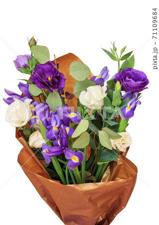Beautiful bouquet of purple and white flowers with wrapping paper. Beautiful bouquet of purple and white flowers with wrapping paper. 71109684
