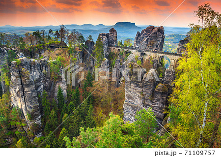 Famous stone bridge named Bastei in Germany, Saxon Switzerland, Europe Famous stone bridge named Bastei in Germany, Saxon Switzerland, Europe 71109757