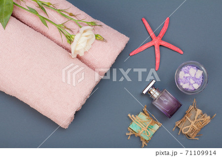 Spa products for facial and body care. Sea salt, homemade soap and towel. 71109914