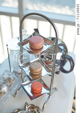 Closeup of macaron with tea set.. 71116845