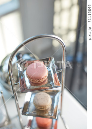 Closeup of macaron with tea set.. 71116846