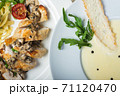 Top view of a restaurant table served with a multi-course set lunch and drink. Complex lunch. 71120470