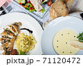 Top view of a restaurant table served with a multi-course set lunch and drink. Complex lunch. 71120472