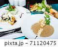 Mushroom soup, white fish fillet with herbs and rice, salad with chicken breast and vegetables. 71120475