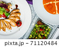 Top view of a restaurant table served with a multi-course set lunch and drink. Complex lunch. 71120484