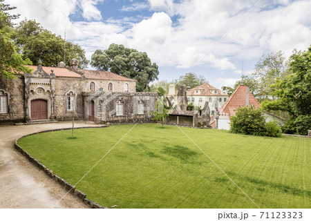 Building in front of lawn in Quinta da Regaleira park in Sintra, Portugal Building in front of lawn in Quinta da Regaleira park in Sintra, Portugal 71123323