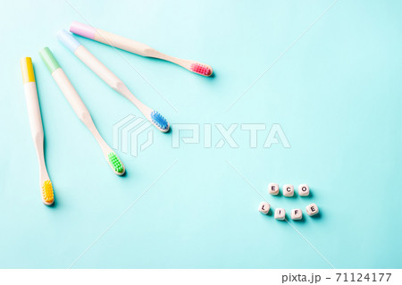 Colorful bamboo toothbrushes. Eco friendly concept. 71124177