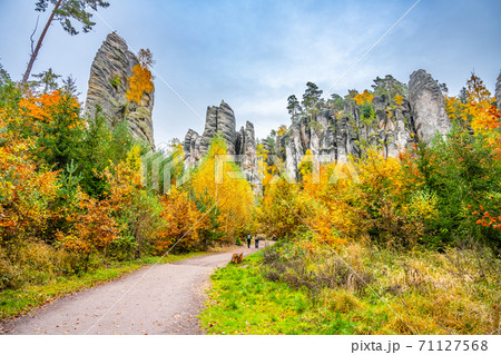 Sandstone rock formations in vibrant autumn forest Sandstone rock formations in vibrant autumn forest 71127568
