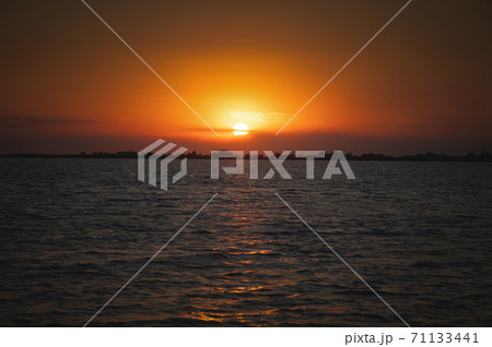 Sunset over the sea lake bay. Low key 71133441