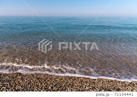 Beach of the morning calm sea in cold colors. Peace by the water Beach of the morning calm sea in cold colors. Peace by the water 71134441