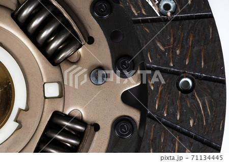 Close-up on the new clutch disc. Background preparation for repairs of the chassis and gearbox Close-up on the new clutch disc. Background preparation for repairs of the chassis and gearbox 71134445