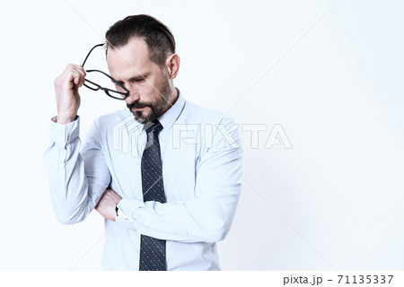 A man in a shirt with severe pain. A man in a shirt with severe pain. 71135337