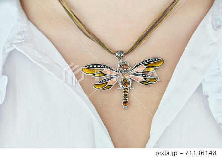young woman neck with butterfly pendant 71136148