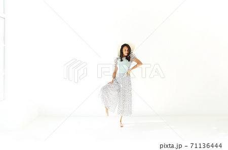 Charming ethnic woman in summer outfit Charming ethnic woman in summer outfit 71136444