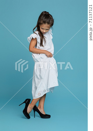 child girl in white oversized dress and shoes child girl in white oversized dress and shoes 71137121