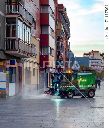 Watering machine cleaning cityscape Barcelona 71137361