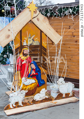 Wooden Christmas nativity scene. Holy family, Baby Jesus, the Virgin Mary and Saint Joseph 71137443