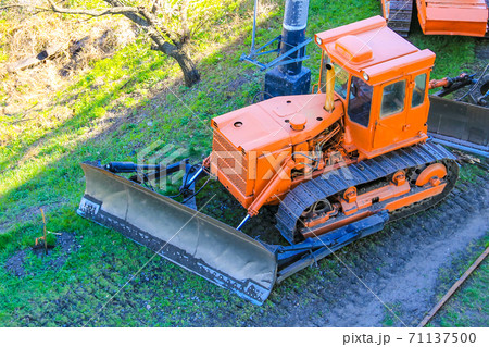 Orange heavy bulldozer at the construction site 71137500