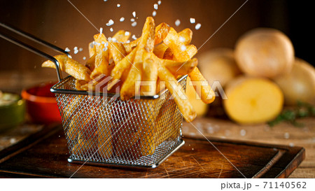 French fries close up with condiments French fries close up with condiments 71140562