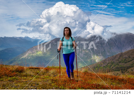 Adventurous Girl Hiking up the Nares Mountain 71141214
