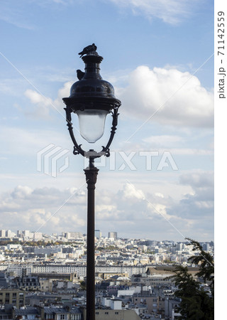 Closeup of street light on roofs of Paris from Montmartre quarter background Closeup of street light on roofs of Paris from Montmartre quarter background 71142559