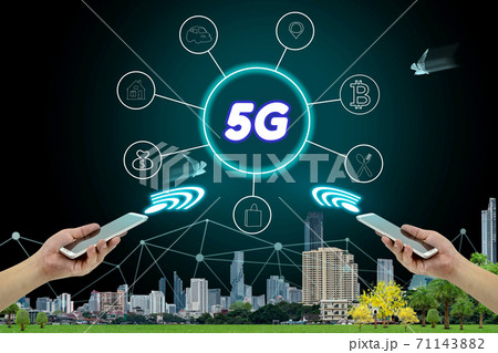 5G network interface and icon concept,hand holding mobile smart phone with cityscape 5G network interface and icon concept,hand holding mobile smart phone with cityscape 71143882