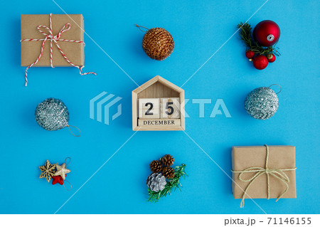 Christmas calendar and Christmas decorations on a blue surface 71146155