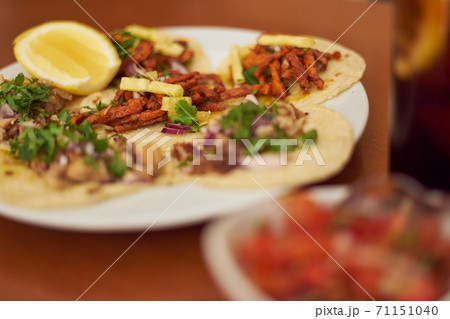 Mexican Tacos "Pastor" and "Carnitas" with pork and beef in yellow tortilla 71151040
