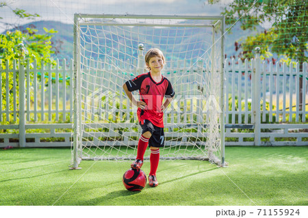 cute teens boys playing soccer