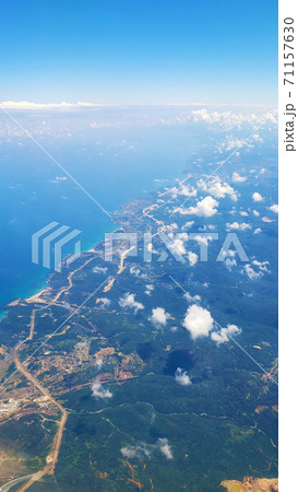 The view from the airplane window to the ground. Landscape view from the sky The view from the airplane window to the ground. Landscape view from the sky 71157630