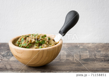 Eggplant baba ganoush on wooden table	 71158851