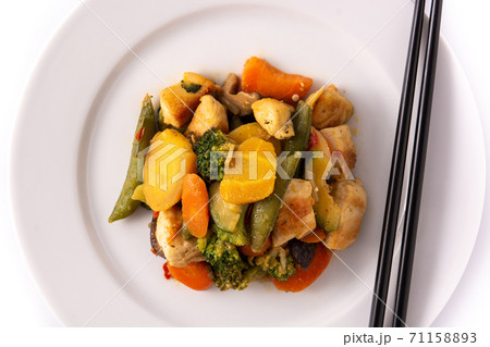 Stir fry chicken with vegetables isolated on white background Stir fry chicken with vegetables isolated on white background 71158893